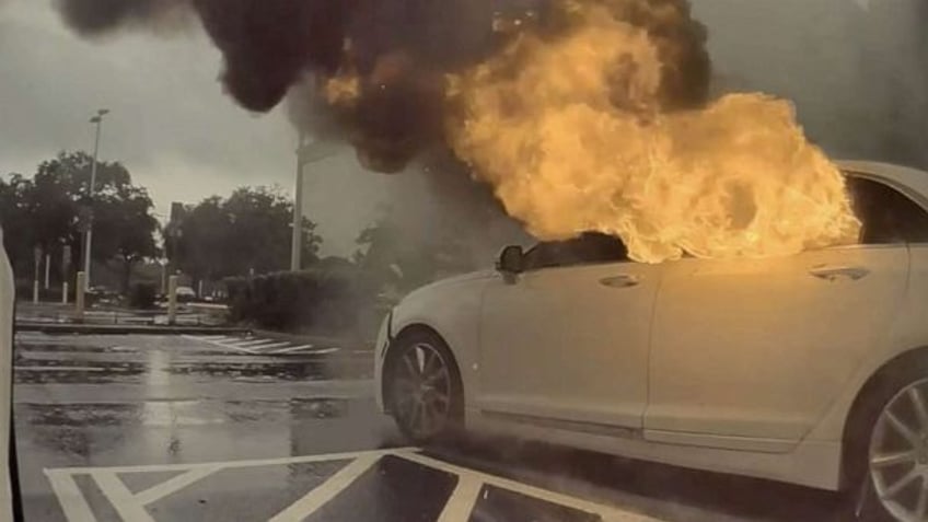 2 children rescued from vehicle on fire as woman shoplifts police