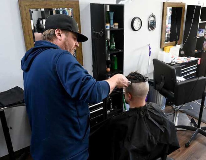 barber shop donates proceeds to help abused children