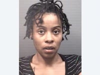 woman charged with assault and child abuse after allegedly jumping out of moving car while holding child