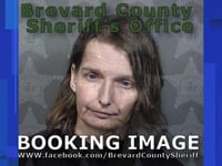 woman kept severely autistic child locked inside of wood and metal cage palm bay police say
